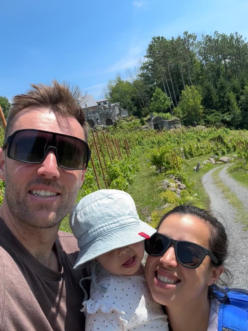 Tristan, Maelle and their daughter on a summer walk in the Eastern Townships